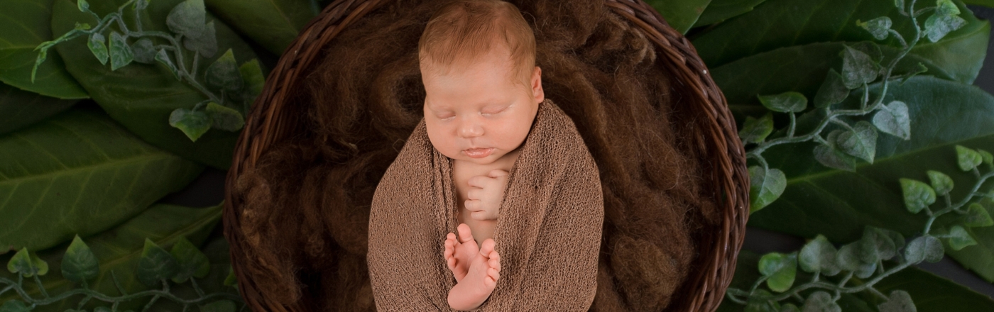 Newbornshooting eines kleinen Herzenbrechers